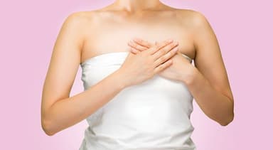 Picture of woman holding breast.