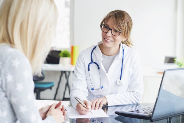 Image of a doctor talking with a patient.