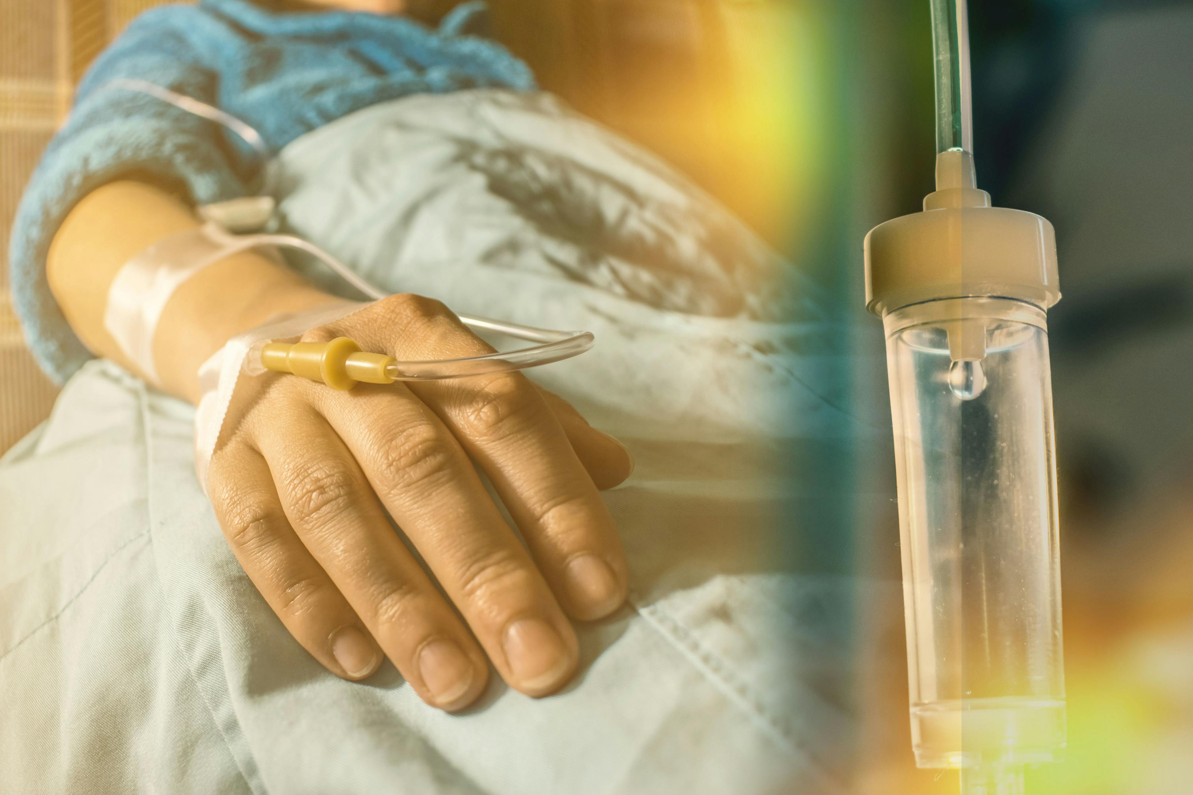 Image of a person receiving treatment via an IV.