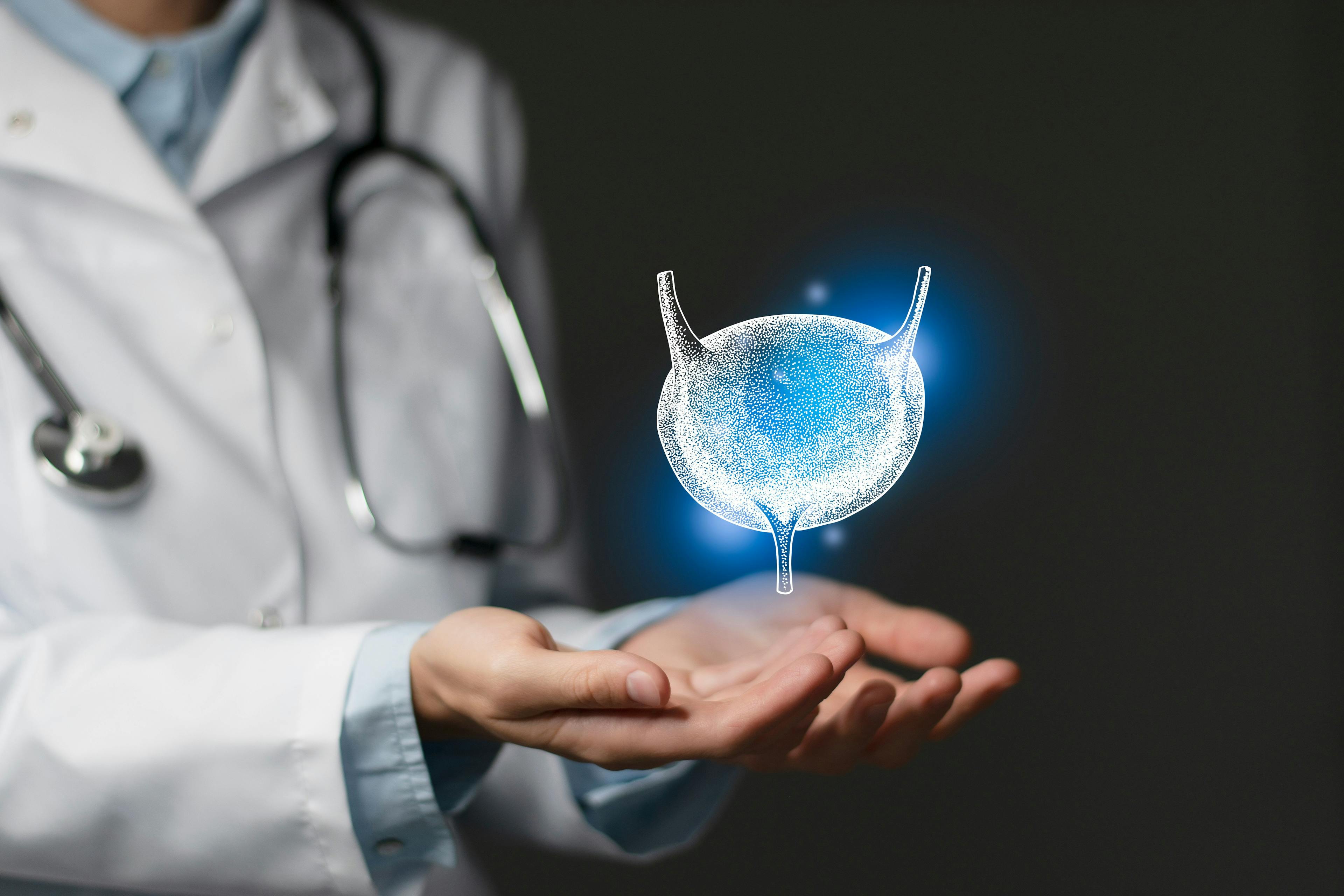 doctor in white coat with conceptual image of a bladder floating above his hands