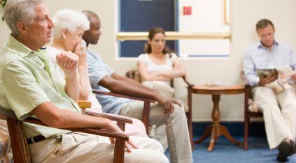 Image of people waiting in a waiting room. 