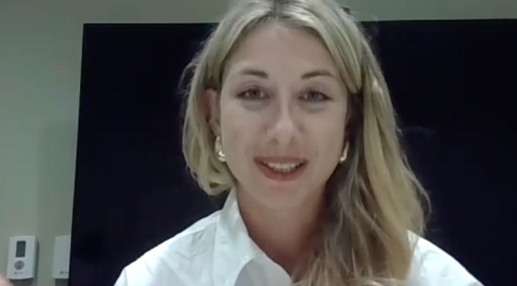 Image of a woman with long blonde hair and large gold earrings. 