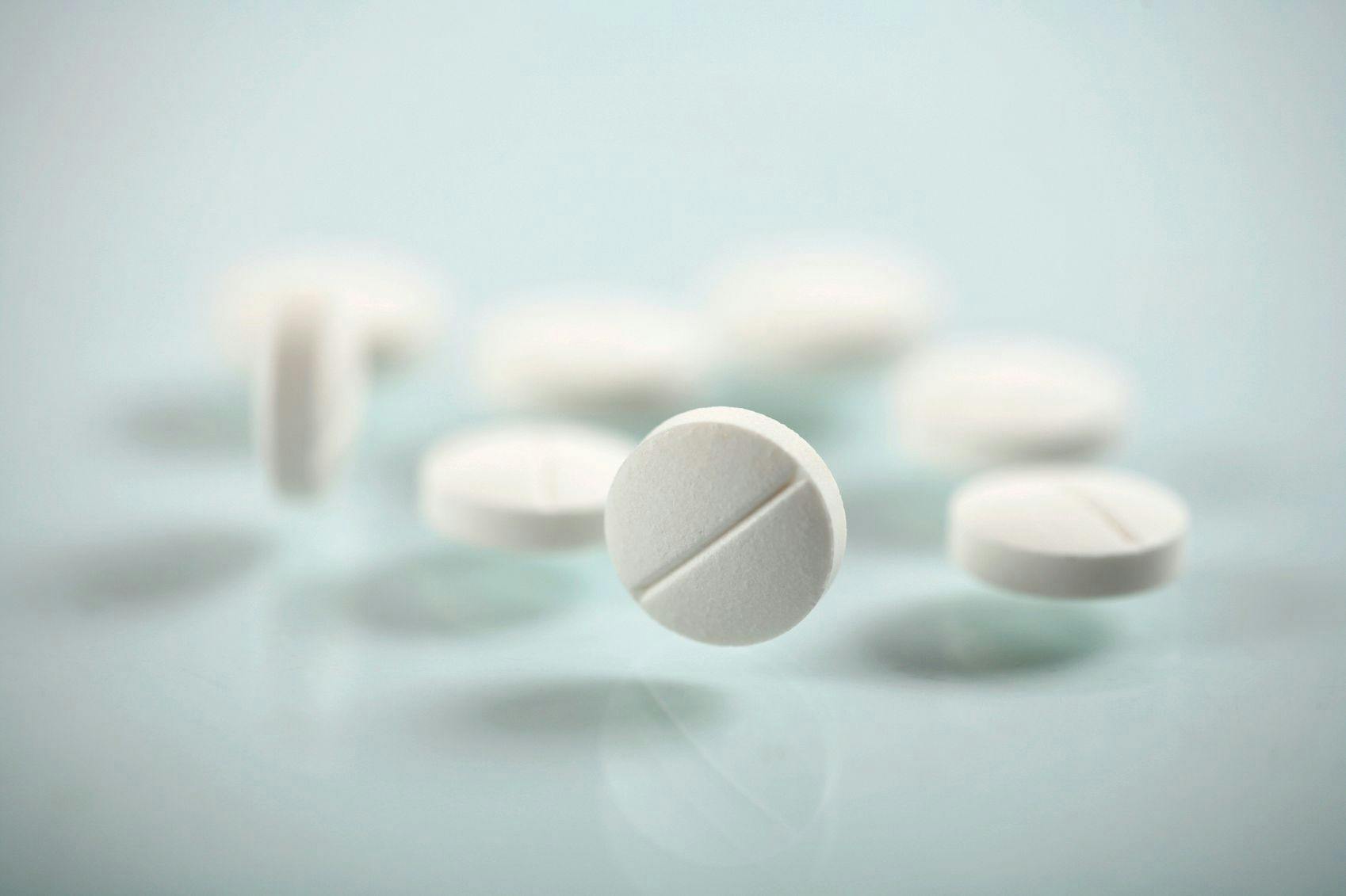 Image of white circular pills.