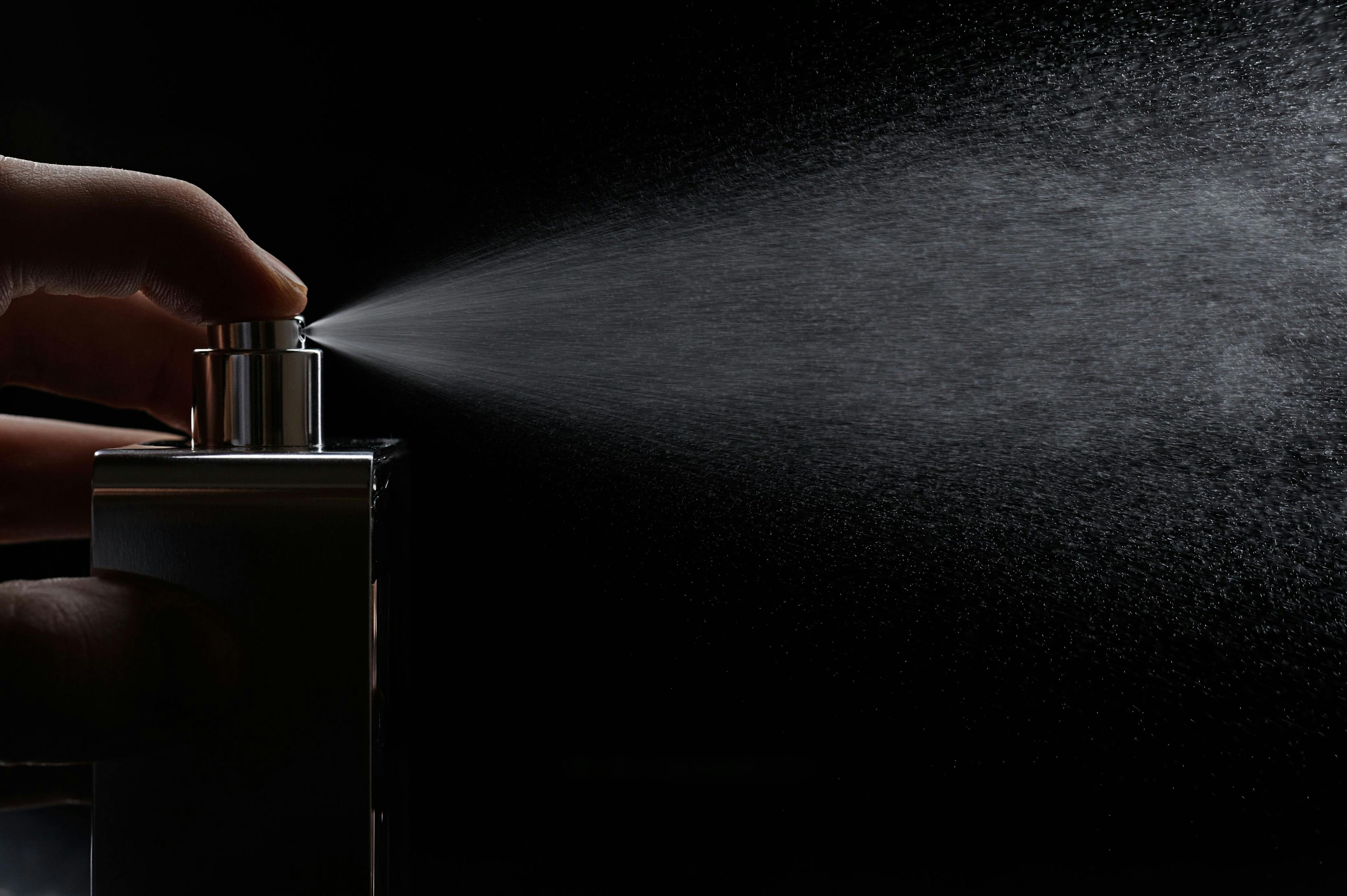 spray perfume on black | Image credit: - © PixieMe - © stock.adobe.com